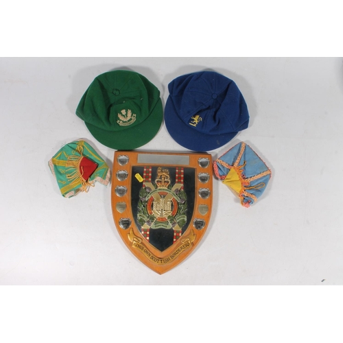 116 - Kings Own Scottish Borderers regimental plaque and school caps.