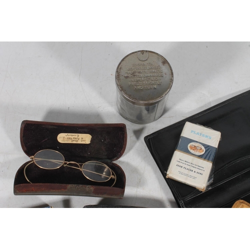 118 - Early 20th century spectacles, in cases, leather wallets, etc.