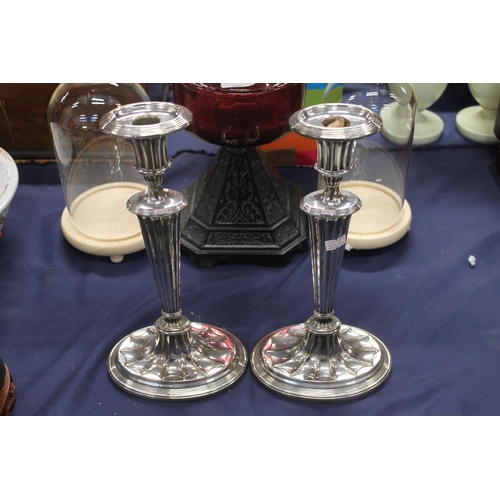 83 - Pair of Victorian silver-plated candlesticks.