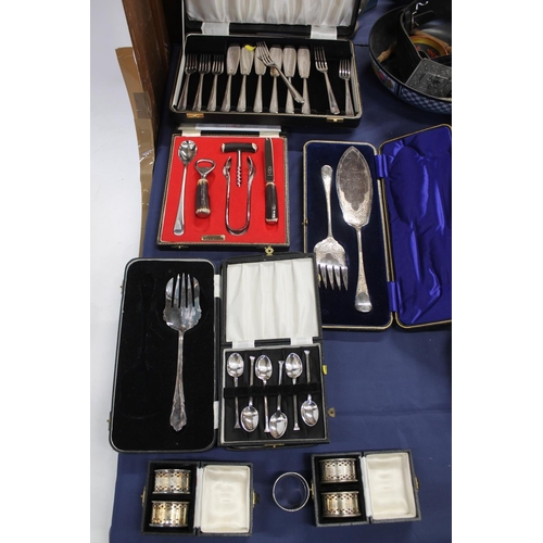 87 - Silver-plated cutlery, fish servers, fish knives and forks, coffee spoon, napkin rings, etc.