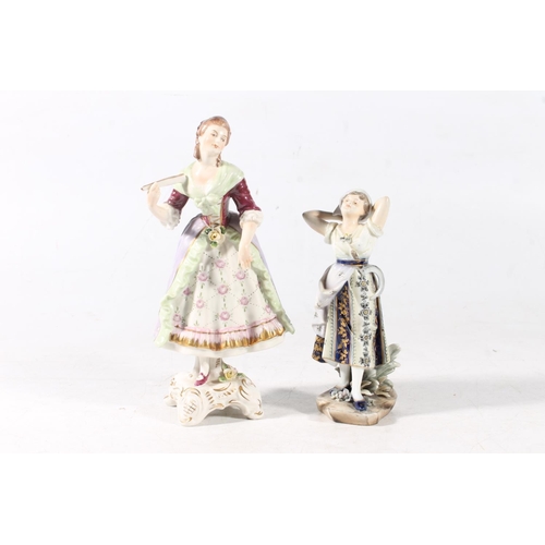 94 - Continental porcelain figurine of a lady, and a German porcelain figurine.