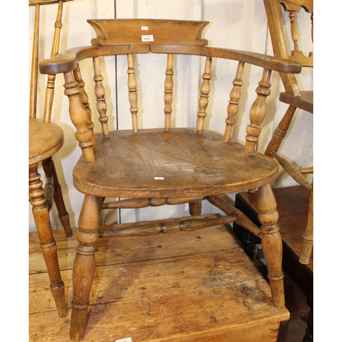 676 - Bow back farmhouse elbow chair.