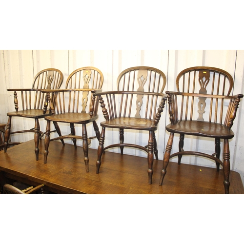 685 - Eight low back spindle elbow chairs.