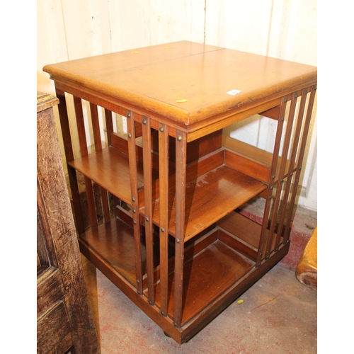 686 - Early 20th century revolving bookcase, 92cm high.