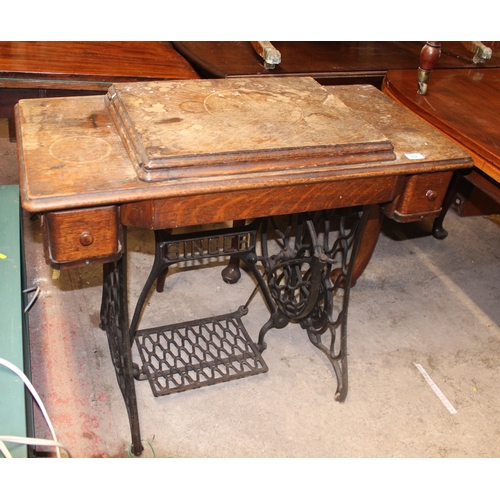 702 - Singer sewing machine in original table base.