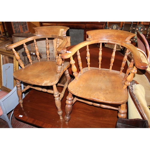 748 - Pair of bow back elbow chairs.