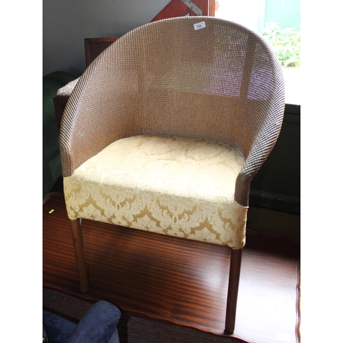 755 - Lloyd Loom style armchair.