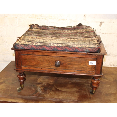 772 - Late Victorian stool on brass castors, topped by a Nomadic saddle bag rug.