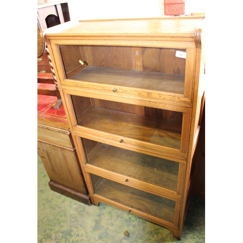 791 - Oak Globe Wernicke style four section bookcase, label to the back Kenric & Jefferson Ltd.