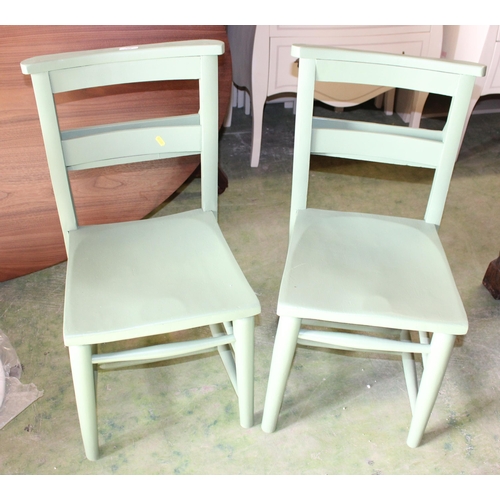 798 - Pair of green painted school chairs.