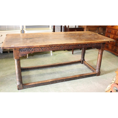 799 - 18th/19th century oak refectory dining table with panel top, 183cm long.