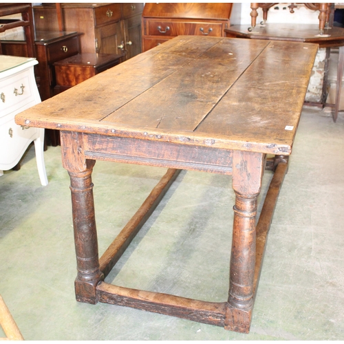 799 - 18th/19th century oak refectory dining table with panel top, 183cm long.