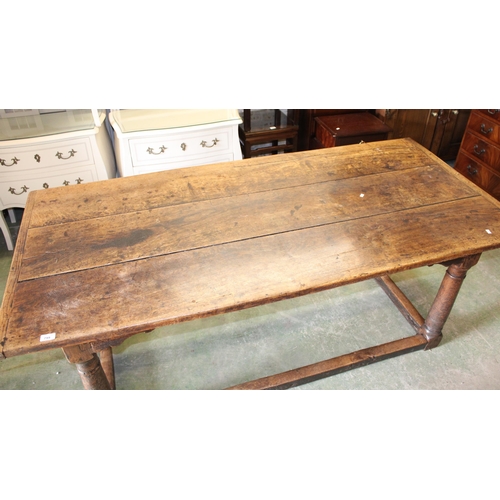 799 - 18th/19th century oak refectory dining table with panel top, 183cm long.