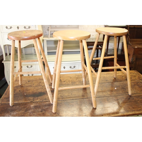 801 - Three pine stools.