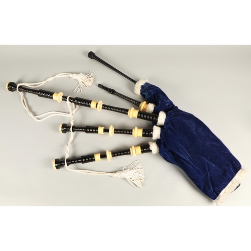 210 - Set of Ivory Mounted bagpipes, unsigned, turned black hardwood with ivory mounts, blue velvet bag in... 