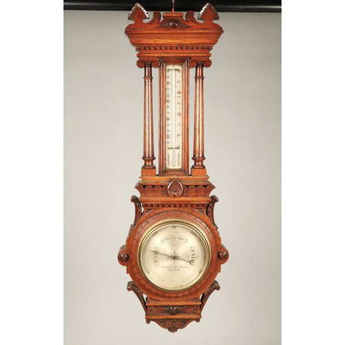 179 - Carved oak barometer, 100cm long.