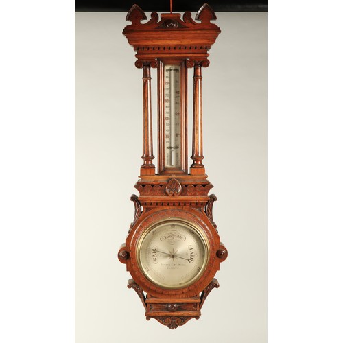 179 - Carved oak barometer, 100cm long.