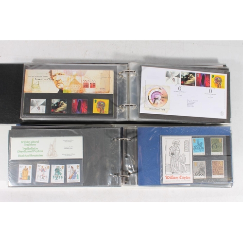 232 - Two ring binder albums containing mint stamp presentation packs, first day covers etc.