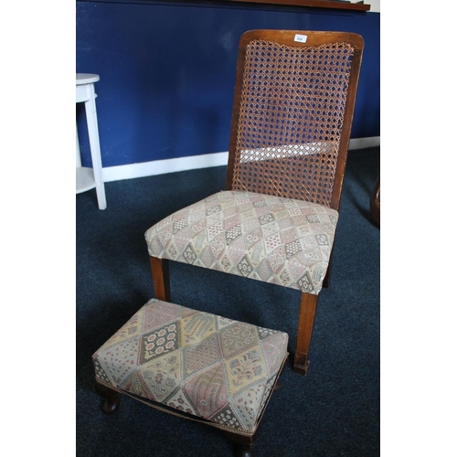 804 - Bergere backed chair and matching footstool.