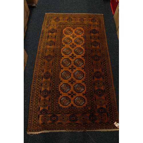 818 - Orange ground multi border fringed rug, 180cm long.