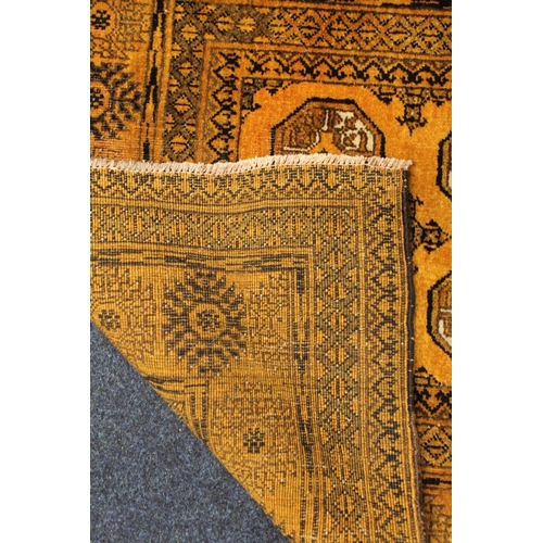 818 - Orange ground multi border fringed rug, 180cm long.