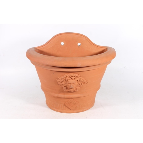 820 - Terracotta wall planter.