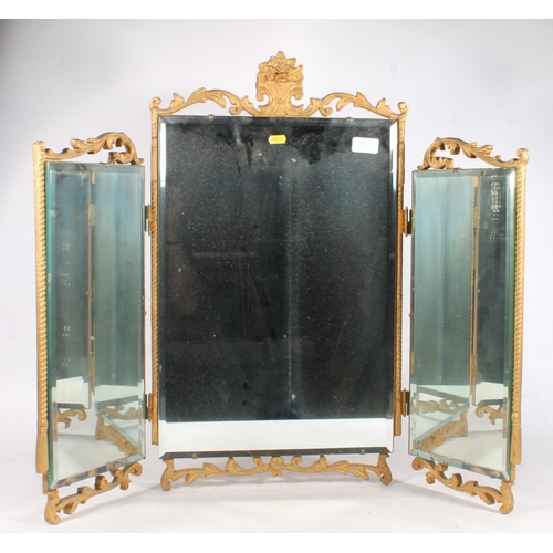 289G - Triptych mirror with gilt and ornate border.