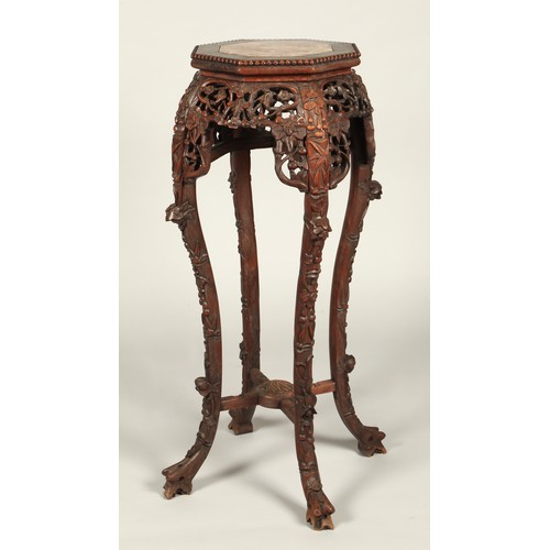 530 - Chinese hardwood jardiniere stand with octagonal top with rouge marble inset, with ornately carved a... 