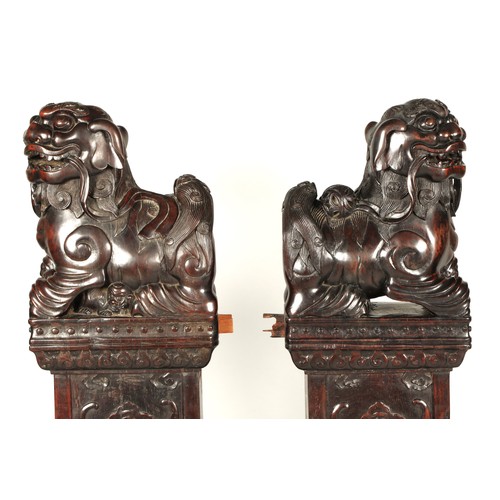 538 - Pair of carved hardwood Chinese foo dogs.128cm high