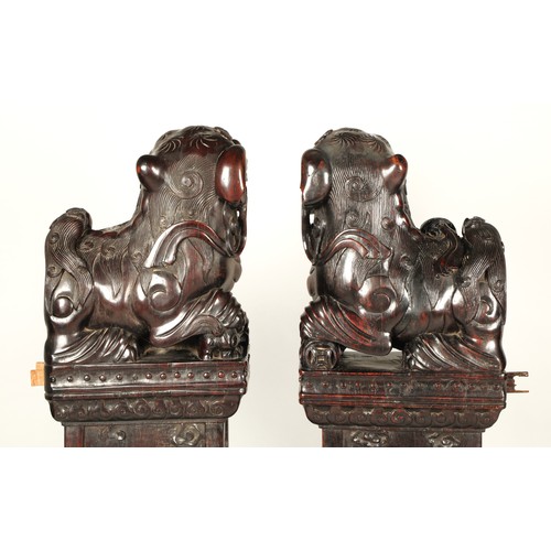 538 - Pair of carved hardwood Chinese foo dogs.128cm high