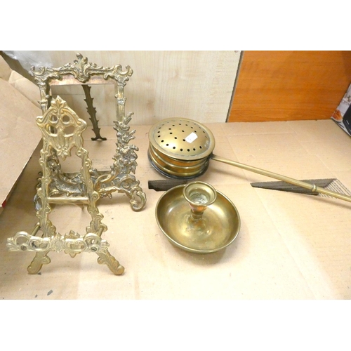 52 - Two brass easel photo frames, chamber stick, chestnut toaster and other metal ware.