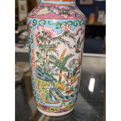 96A - Chinese Canton famille rose vase decorated with birds of paradise among trees and flowers, 18cm high... 