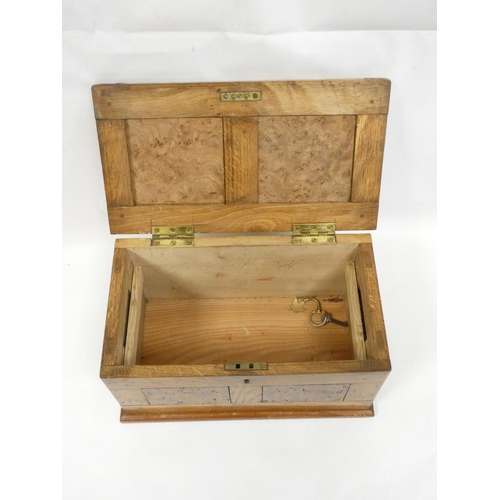 268 - Apprentice oak storage box with burr walnut panels. Height 17cm, Width 32cm, Depth 18cm.