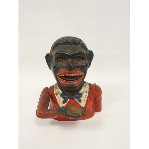 276 - 1930s painted cast iron blackamoor money box. Height 17cm.