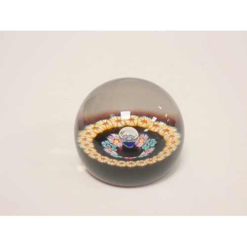 287 - Two art glass paperweights, a Whitefriars faceted millefiori cylindrical paperweight dated 1974, and... 