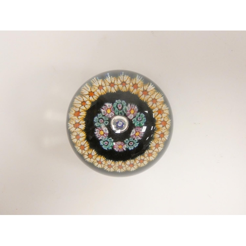 287 - Two art glass paperweights, a Whitefriars faceted millefiori cylindrical paperweight dated 1974, and... 