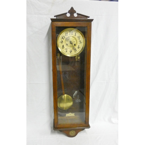 139 - Early 20th century oak cased wall clock with ivorine and gilt dial. Height 99cm. 