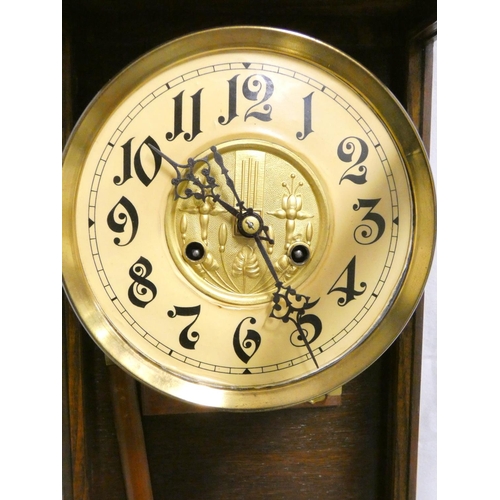 139 - Early 20th century oak cased wall clock with ivorine and gilt dial. Height 99cm. 