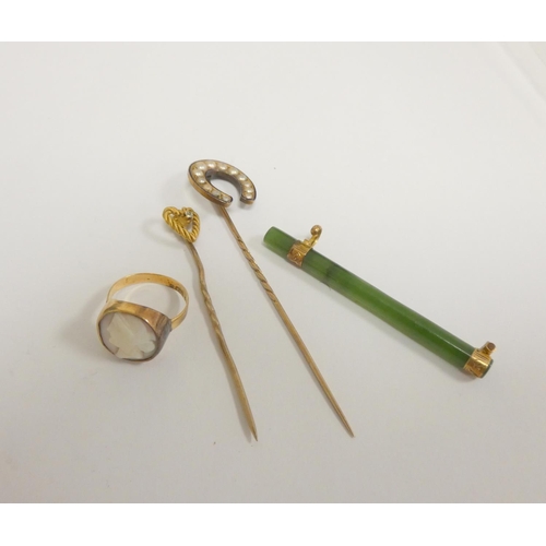 65 - Gold jewellery to include a Georgian 18ct gold ring with shell cameo, a 15ct gold stick pin, another... 