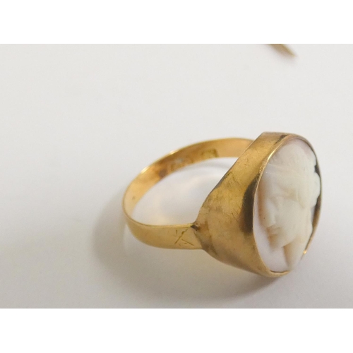 65 - Gold jewellery to include a Georgian 18ct gold ring with shell cameo, a 15ct gold stick pin, another... 