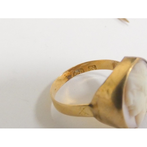 65 - Gold jewellery to include a Georgian 18ct gold ring with shell cameo, a 15ct gold stick pin, another... 