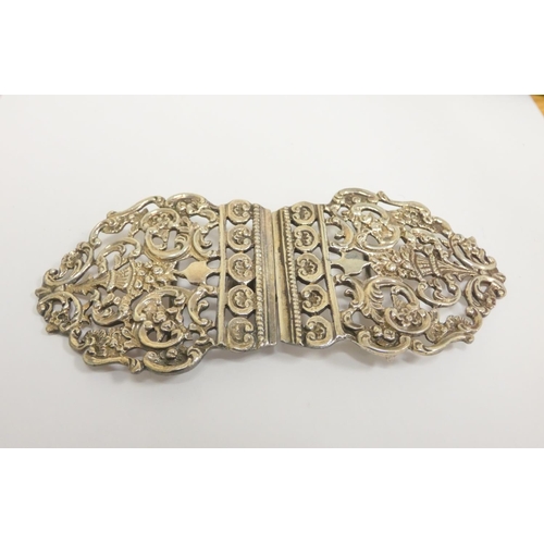 67 - Sterling silver belt buckle of pierced form by William Comyns & Sons, London 1910. Also ano... 