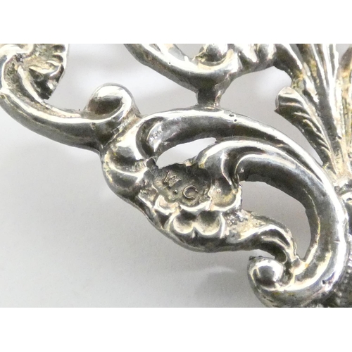 67 - Sterling silver belt buckle of pierced form by William Comyns & Sons, London 1910. Also ano... 