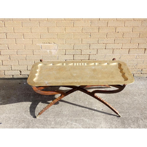 436 - Indian Benares brass rectangular coffee table on bone inlaid folding supports.