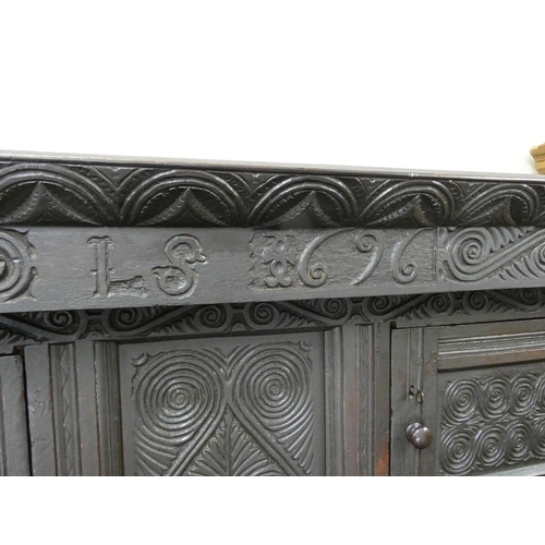 438 - Antique oak court cupboard the top bearing initials I.S and date 1696 above barley twist columns and... 