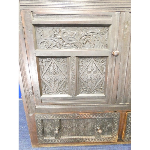 438 - Antique oak court cupboard the top bearing initials I.S and date 1696 above barley twist columns and... 