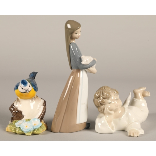 13 - Two Lladro figurines a girl with piglet and an angel cherub, and a Beswick bluetit figurine (3)