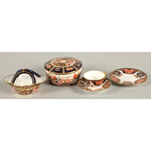 18 - Royal Crown Derby Imari pattern miniature tea cup, saucer and side plate, basket, and lidded pot