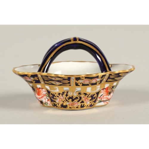 18 - Royal Crown Derby Imari pattern miniature tea cup, saucer and side plate, basket, and lidded pot