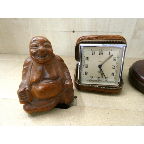 63 - Smiths travelling alarm clock, tape and carved treen budha